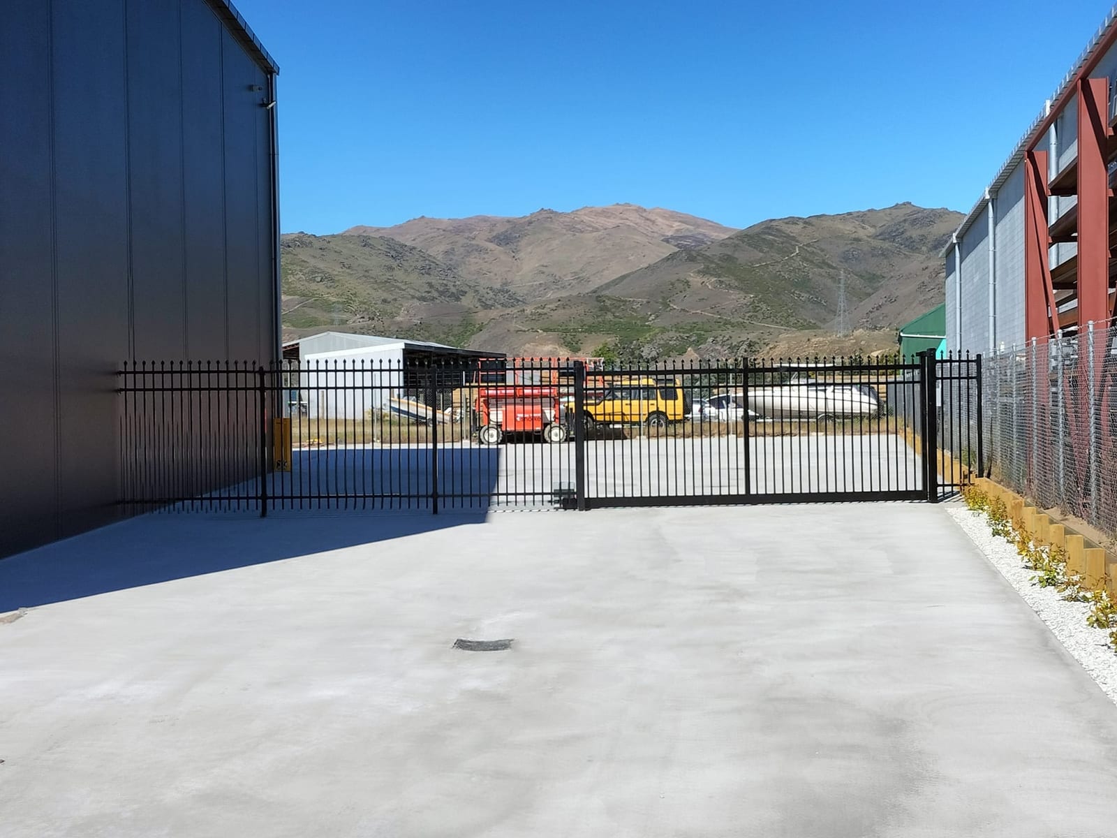 Wide view of an automatic commercial gate installation, Queenstown