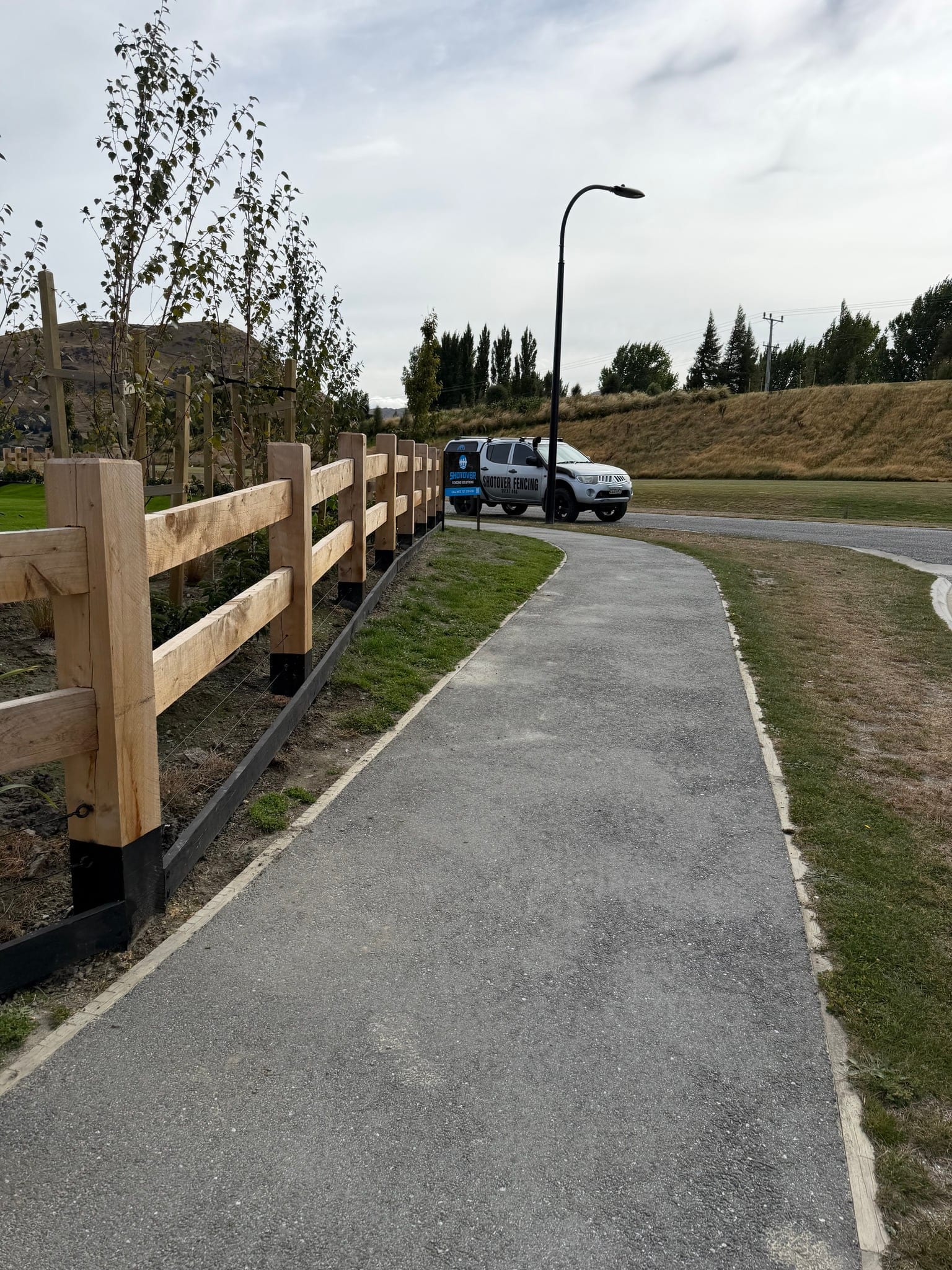 Macrocarpa fencing along a path at Hanley's Farm, Queenstown