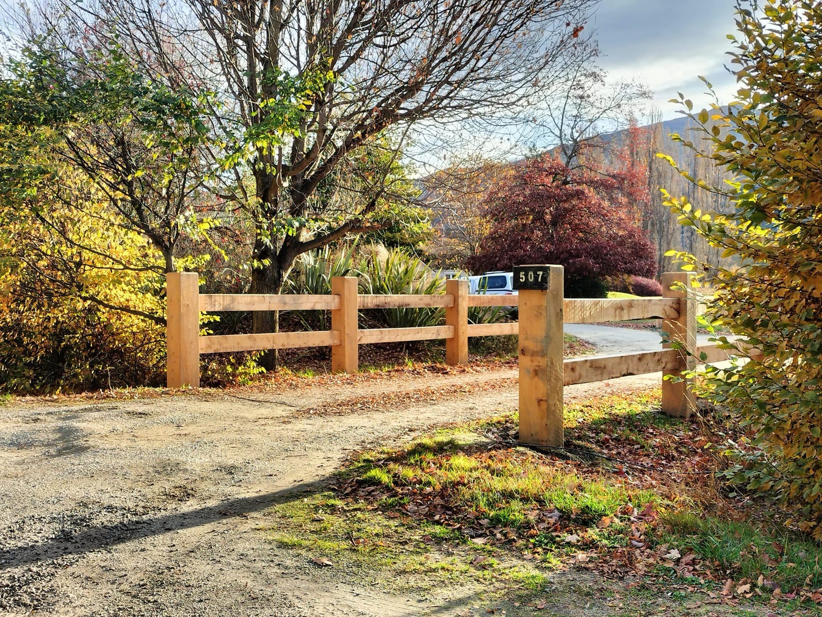 Macrocarpa post and rail fencing in autumn colours, Queenstown