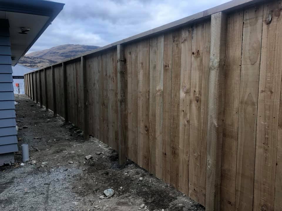 Long run of pine paling fencing with mountain views, Queenstown