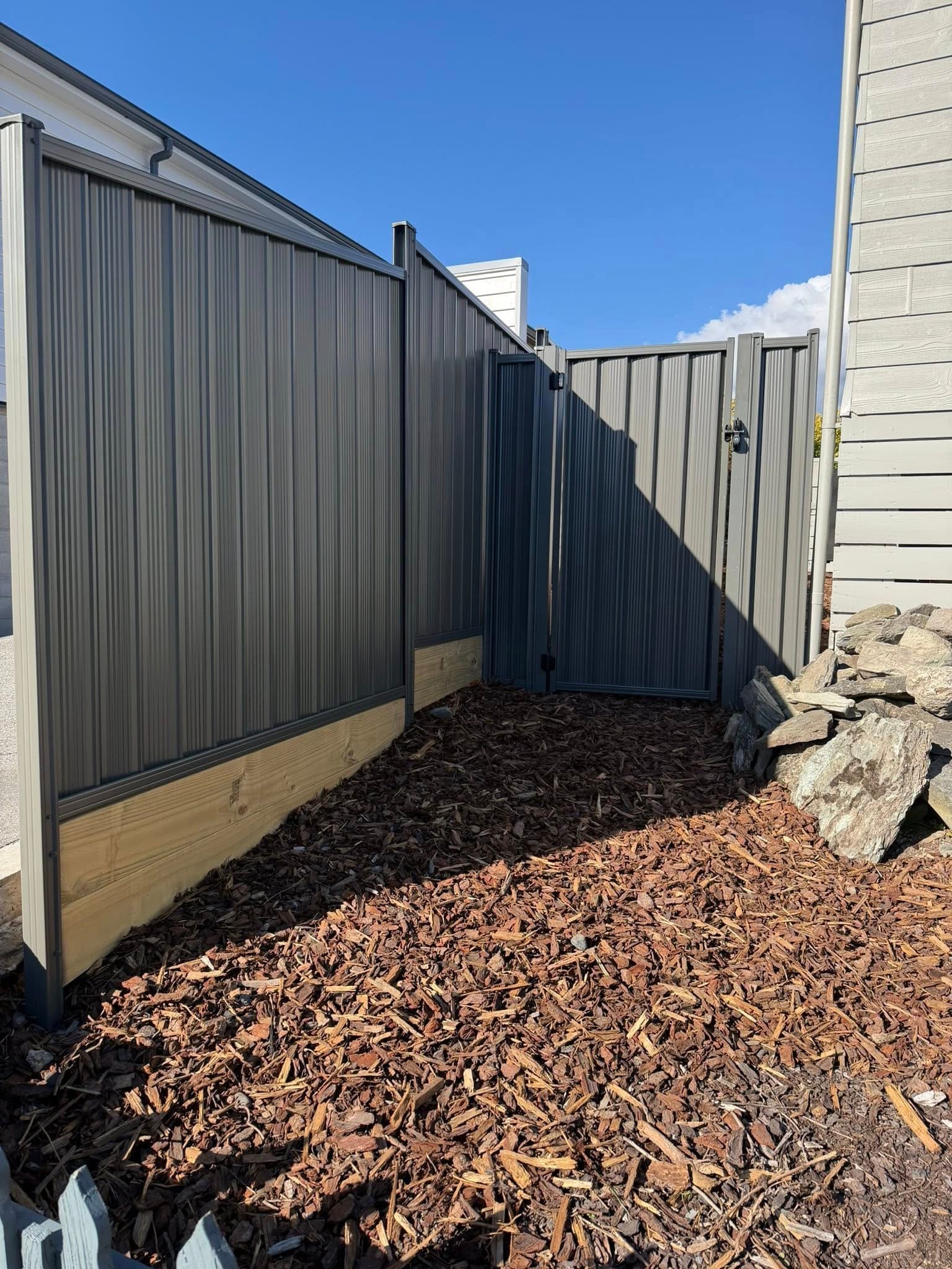 Colorsteel corner fencing on a residential property, Queenstown