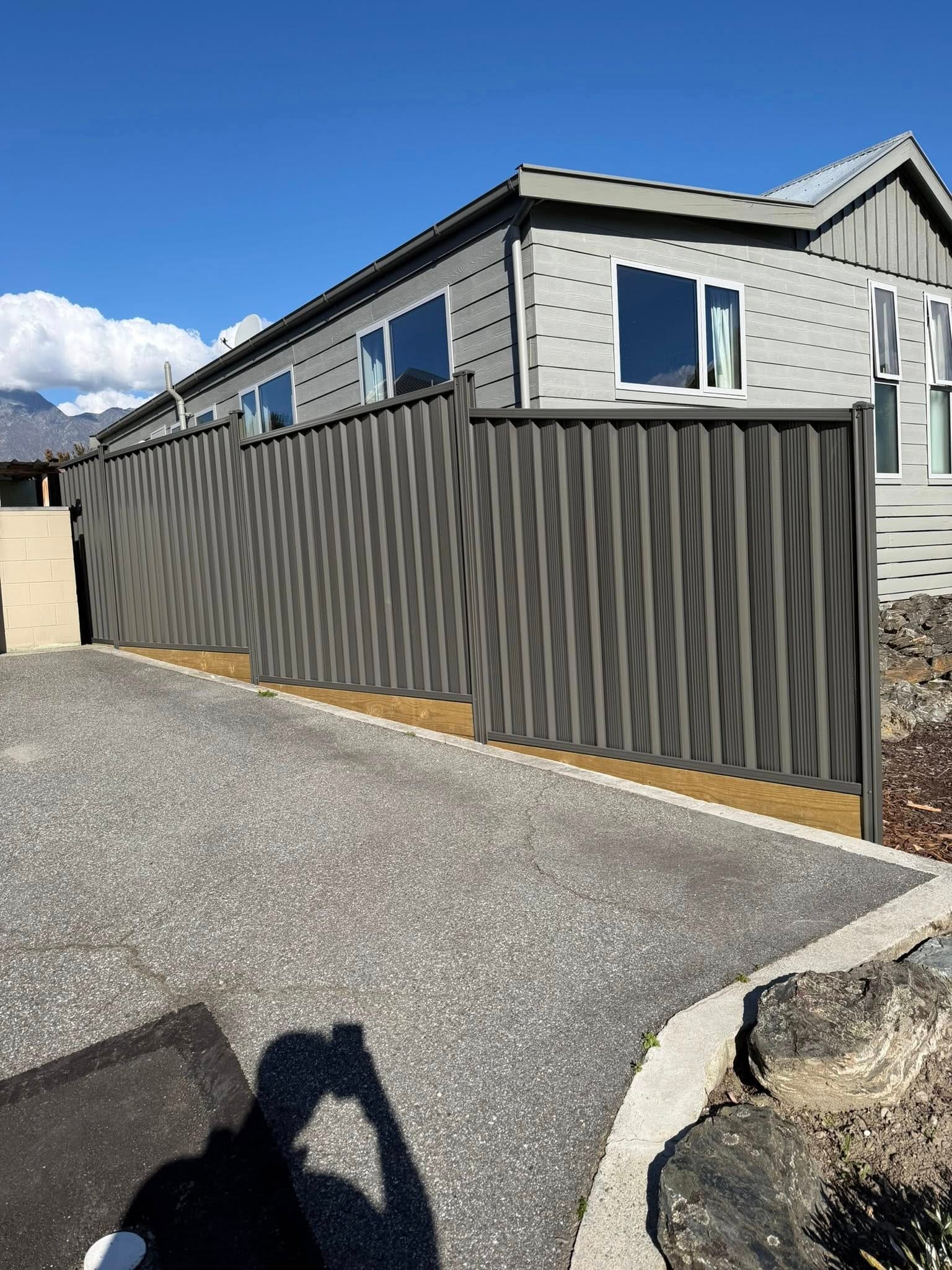 Colorsteel fencing along a driveway, Queenstown