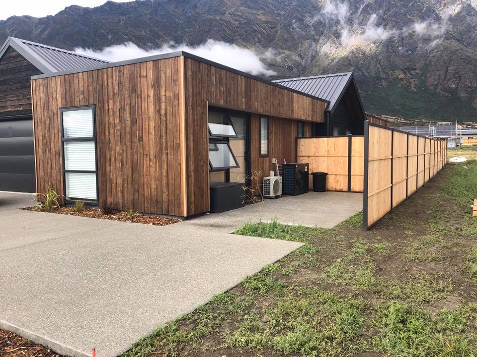 Timber panel fencing under dramatic sky, Queenstown