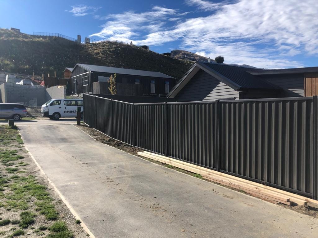 Grey colorbond fencing in a Queenstown subdivision
